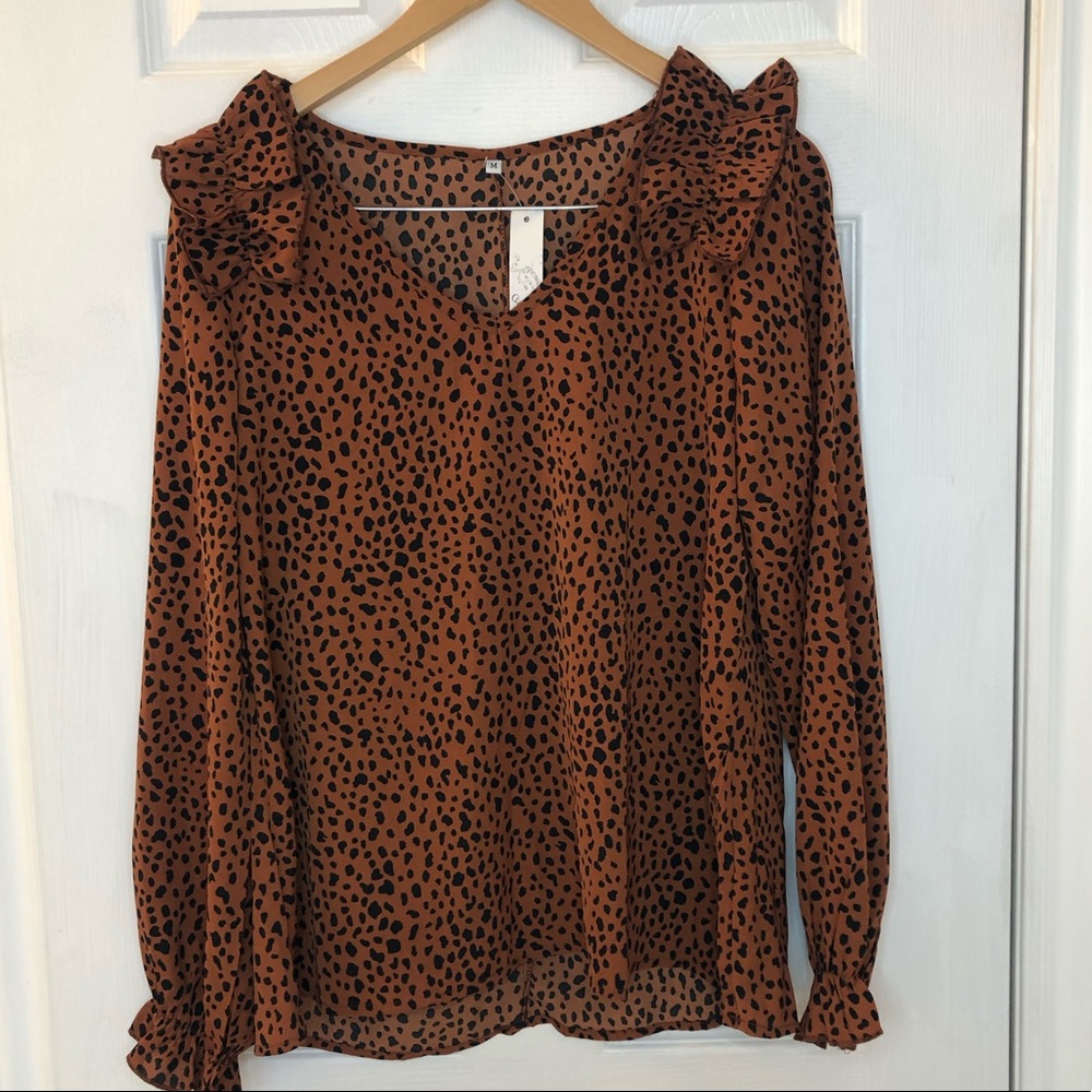 New! Cheetah print blouse with ruffle shoulder and cuffs, medium